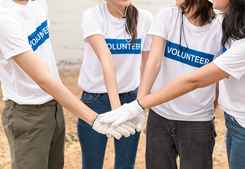 volunteers holding hands