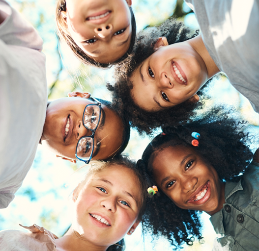 a group of kids in a circle all smiling in kitsap county washington
